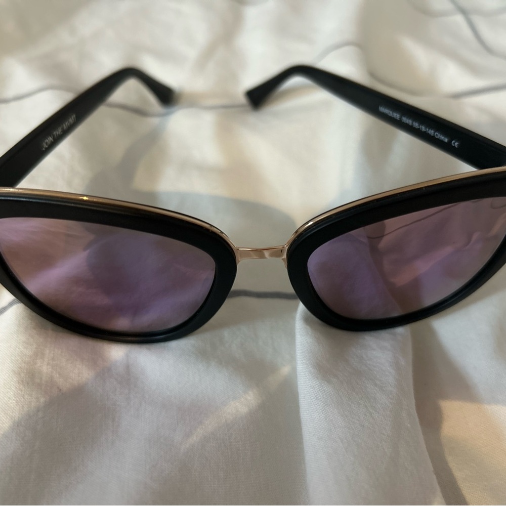 Stylish Black and Gold MVMT Sunglasses